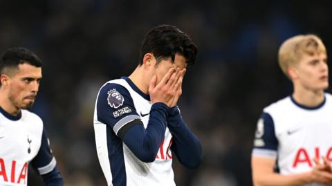 Son Heung-min looks dejected with head in hands