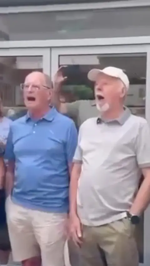 Two men singing