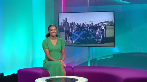 Nina in the studio with Scotland fans in the screen