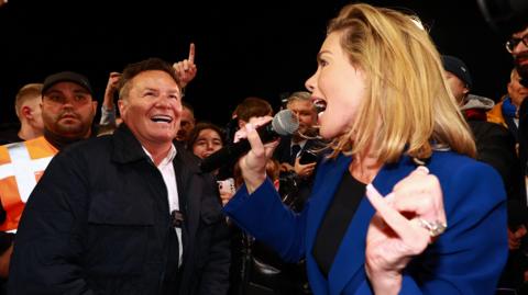 John and Carolyn Radford celebrating Mansfield Town's promotion