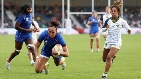 Kelly Arbey of France dives to score 