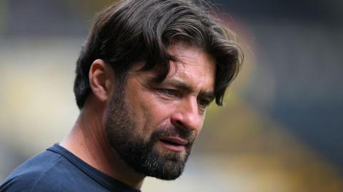 Russell Martin looks on during Leicester City's match with Notts County