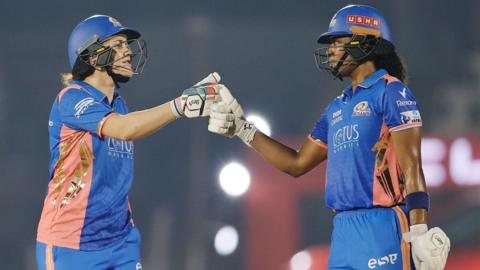 Mumbai Indians' Nat Sciver-Brunt and Hayley Matthews punch gloves