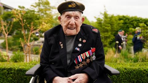 UK's oldest World War Two Veteran Donald Rose is pictured smiling and wearing his service medals