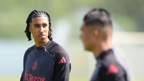 Manchester United's Leny Yoro (left) and Casemiro (blurred out) during a training session at the Carrington Training Centre, Manchester.