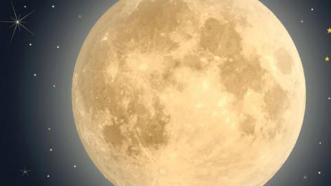 Full Moon at night against pitch black sky