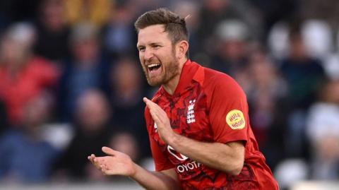 England spinner Liam Dawson celebrates taking a wicket