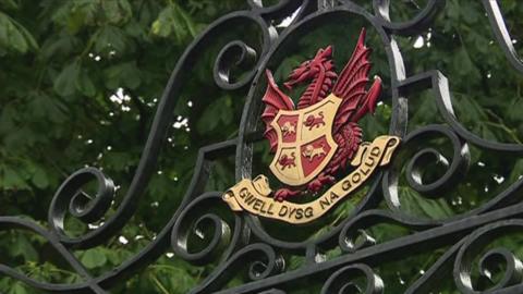 Llandovery College crest on iron school gate, with motto