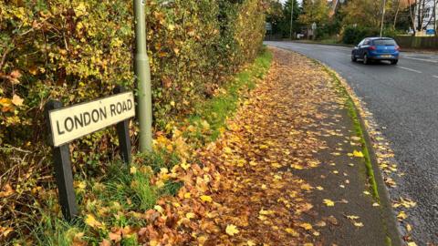 Picture of London Road sign and car