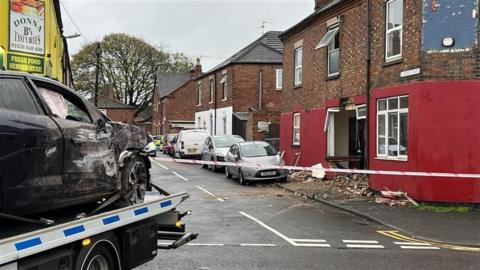 Aftermath of car crashing into house on Currie Road in Newark