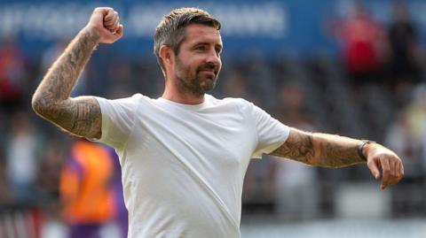 Alan Sheehan manager of Swansea City celebrates at full-time during the Championship match between Swansea City and Sheffield United.
