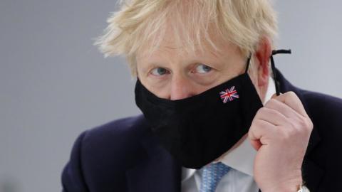 Boris Johnson wearing a face mask in May 2021