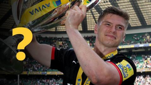 Owen Farrell holds the Premiership trophy