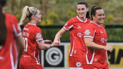 Cliftonville celebrate one of their nine goals against Crusaders