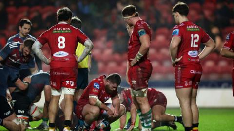 Dejected Scarlets players