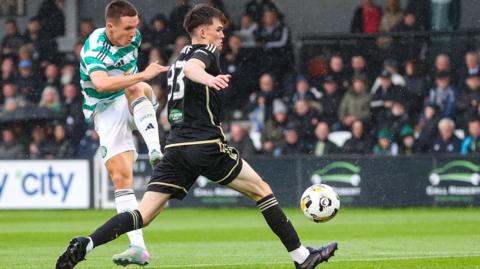 Celtic's Johnny Kenny (left) shoots against Queen's Park