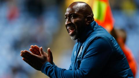 Darren Moore applauds and cajoles his players on the touchline