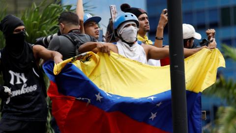 Demonstrators gather to protest election results that awarded Venezuela's President Nicolas Maduro with a third term, in Caracas.