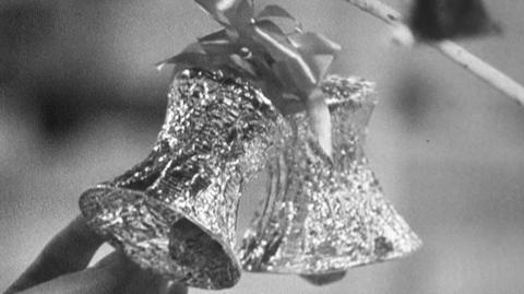 Christmas tree decorations made from wrapping paper, tinfoil and an empty bleach bottle