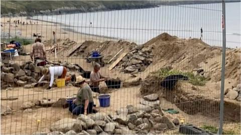 digging at the beachside burial site