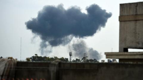 Photo of the crash taken from afar, showing plumes of smoke above the park in Shakarparian