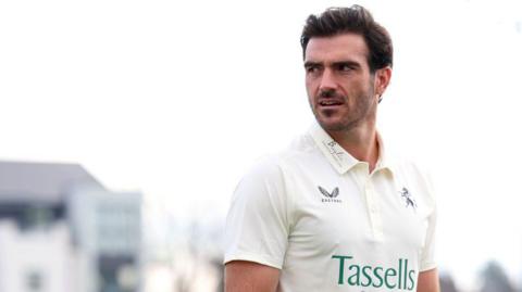 Grant Stewart of Kent CCC looks on during a photocall