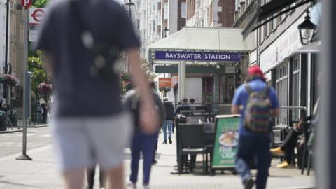 People walking on the street near Bayswater station