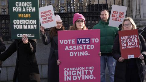 Campaigners for and against the Terminally Ill Adults (End of Life) Bill demonstrate outside the Houses of Parliament