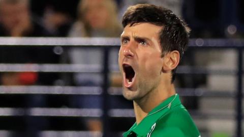 Novak Djokovic celebrates winning Dubai title