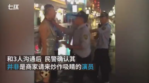 A screengrab showing a police officer pushed the man in the throat