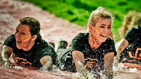 People going down a water slide