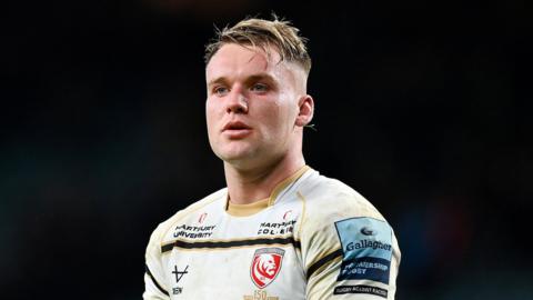 Jack Clement standing on the pitch during a Gloucester match