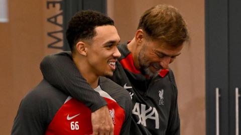 Liverpool manager Jurgen Klopp puts an arm around right-back Trent Alexander-Arnold