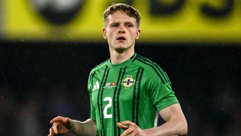 Terry Devlin in action for Northern Ireland against Switzerland