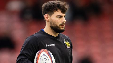 Exeter Chief's player Iwan Jenkins holding a rugby ball