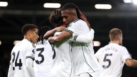 Fulham's Alex Iwobi and Harry Wilson celebrate