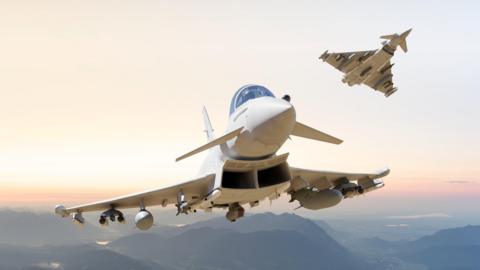 A fighter jet flies through the sky over a mountainous landscape. 