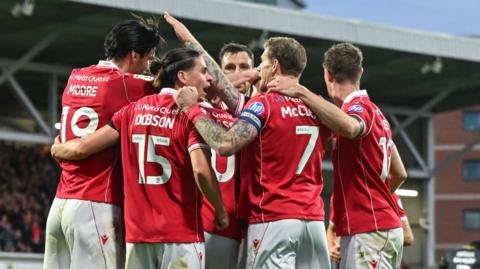 Wrexham players celebrate Josh Windass' goal