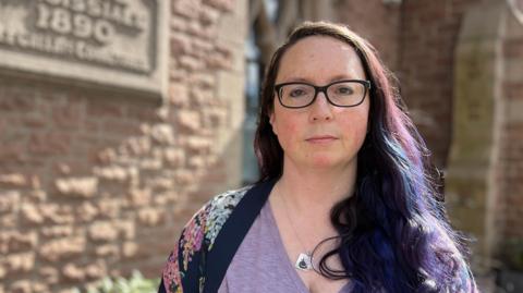 Deputy Louise Doublet is pictured outside St Saviour parish hall. 