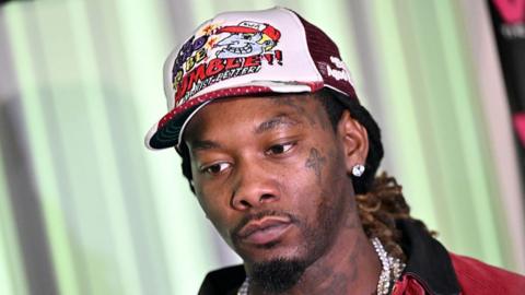 Offset wearing a colourful baseball cap