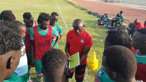 South Sudan coach Ashu Cyprian Besong explains tactics to his players