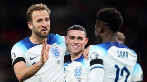 Harry Kane celebrates with England team-mates Bukayo Saka and Phil Foden after scoring during the Euro 2024 qualifier against Malta at Wembley on 17 November, 2023