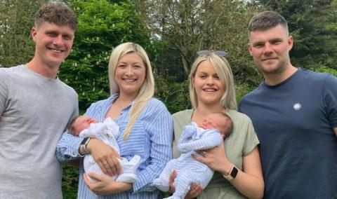 Brothers Joe and George with their partners Hayley and Ellie and the babies