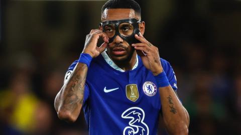 Pierre-Emerick Aubameyang adjusts his face mask while playing for Chelsea