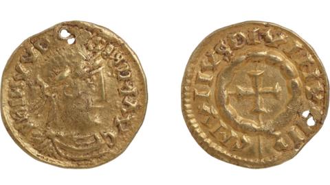 Two views of a gold coin pendant. The left view shows a profile of Louis the Pious, who has a Roman nose, and there is writing on the outside rim. The right view has a cross in the middle and fairly accurate writing on the rim.