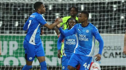 Malik Mothersille (L) of Peterborough United celebrates