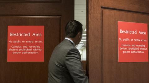 Congressman Devin Nunes enters a restricted House Intelligence Committee meeting.