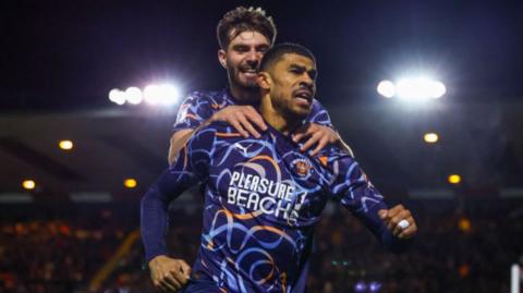 Ashley Fletcher celebrates scoring at Lincoln