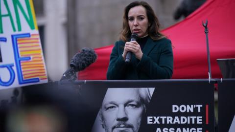Stella Assange, the wife of Julian Assange, addresses supporters outside the High Court in London