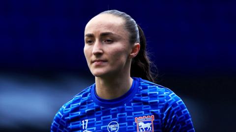 A close-up of Sophie Peskett wearing an Ipswich Town kit during a match in March